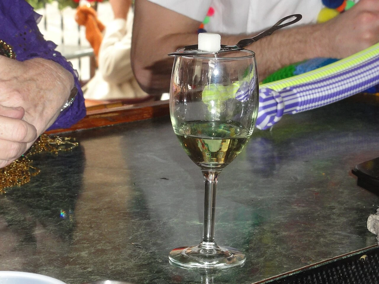 Absinthe cocktail in a chilled cocktail glass with fresh mint garnish