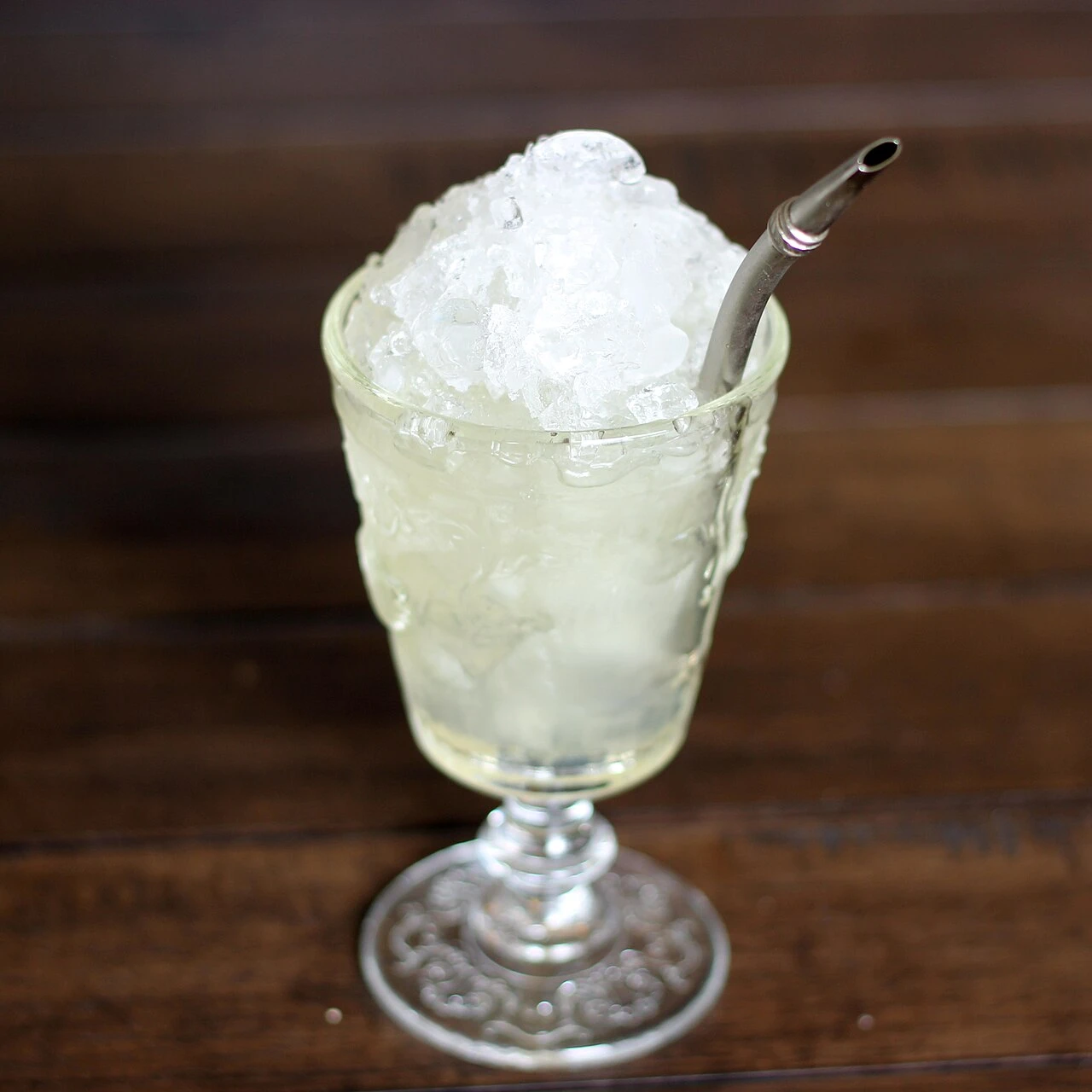 Absinthe Frappé cocktail served over crushed ice in a cocktail glass