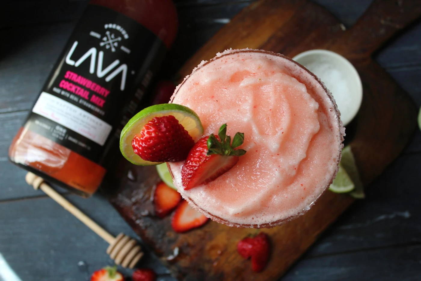 Acapulco Daiquiri ingredients with rum bottle and bar tools