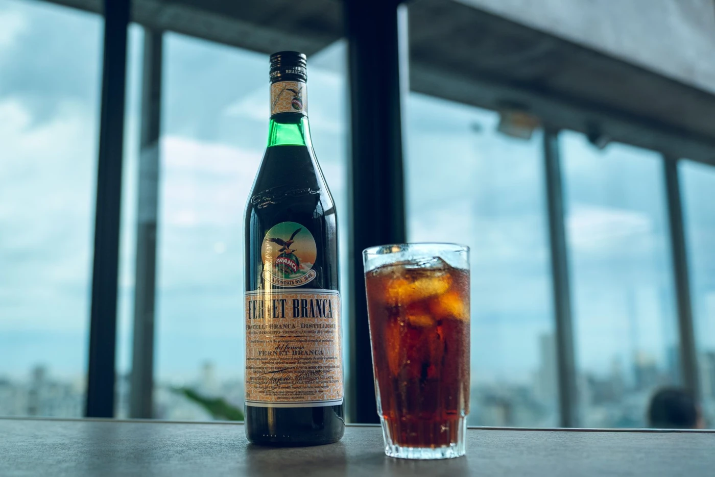 Bartender preparing a Amaro and Fernet cocktail gin cocktail