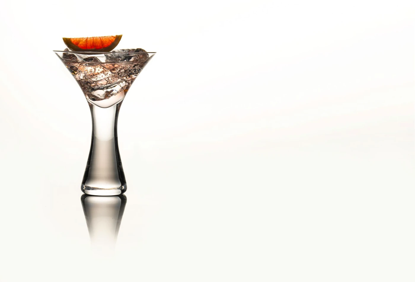 Cornish Sunrise – A Bright & Juicy Orange Gin Cocktail cocktail in a cocktail glass — gin drink photography