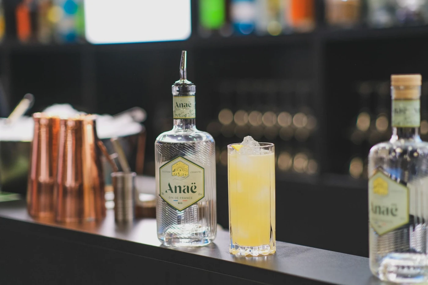 Bartender preparing a French 75 cocktail with Cognac gin cocktail