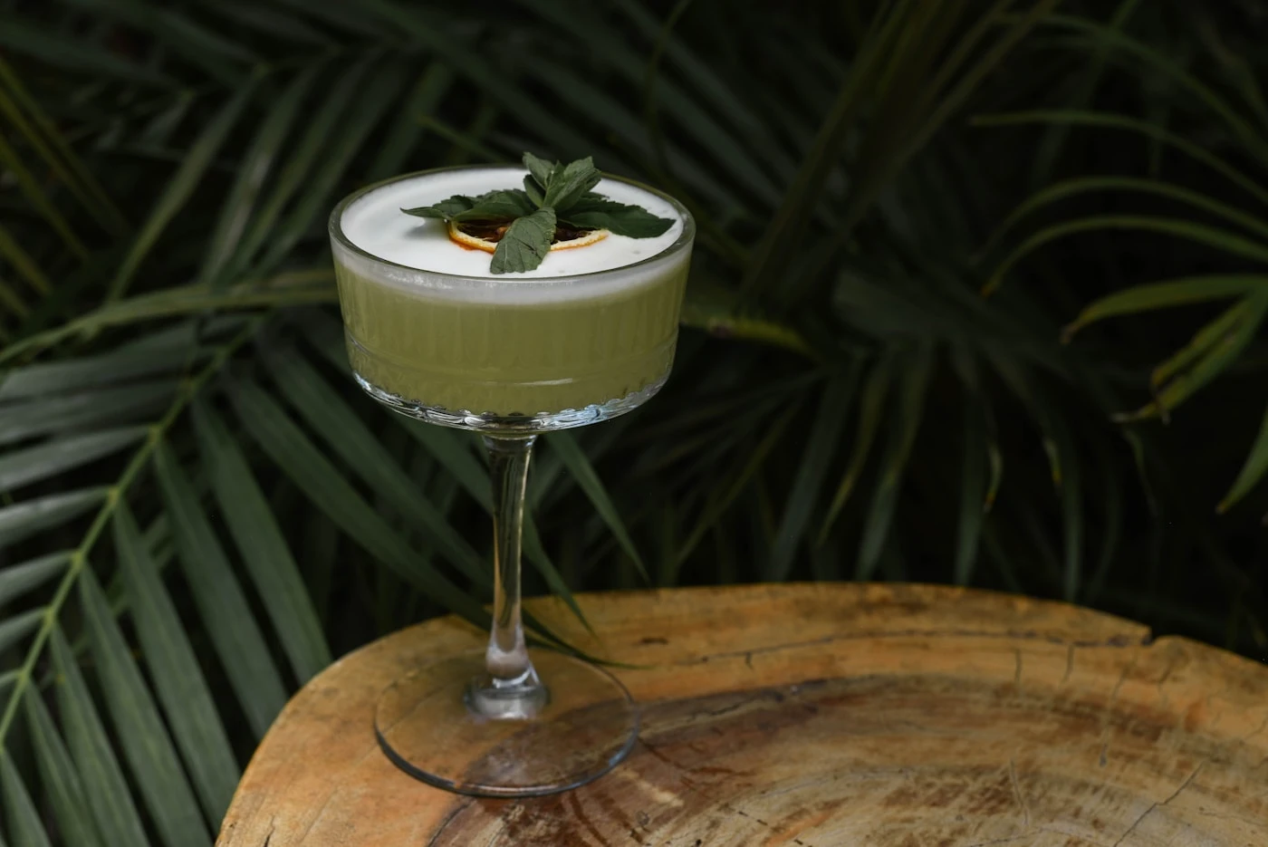 Green Grasshopper-style cocktail with mint garnish in a chilled coupe glass