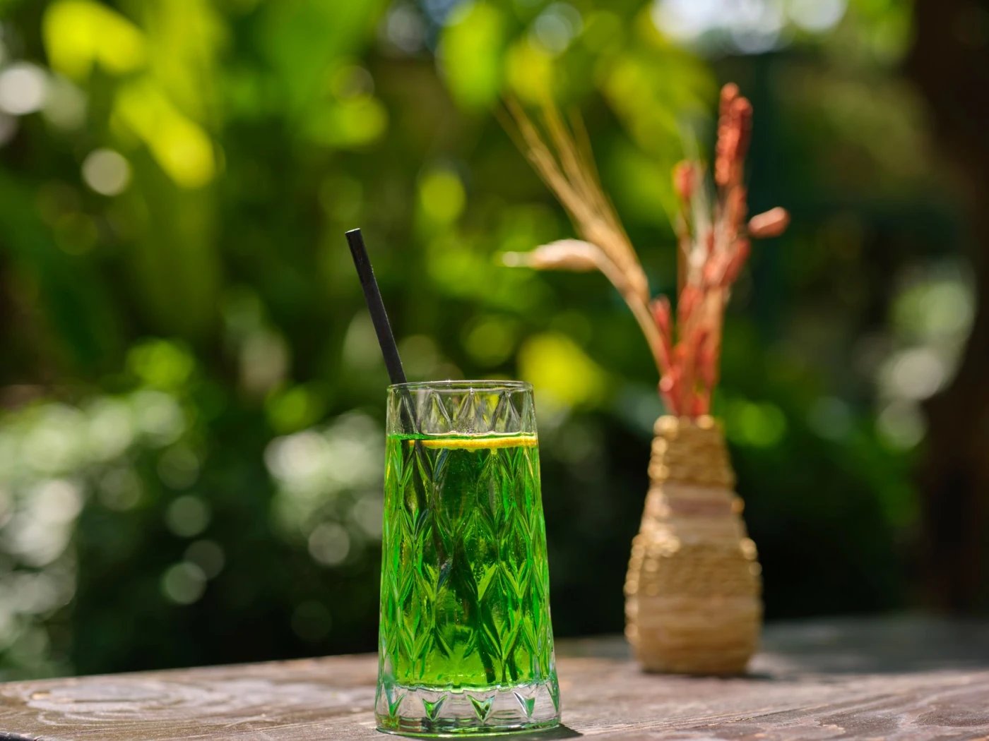 Green Hosting cocktail garnish detail close-up