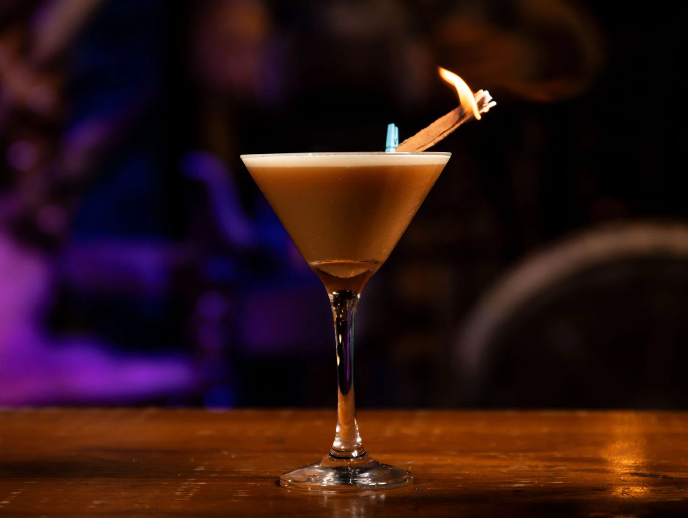 Bartender stirring a Hanky Panky cocktail in a mixing glass