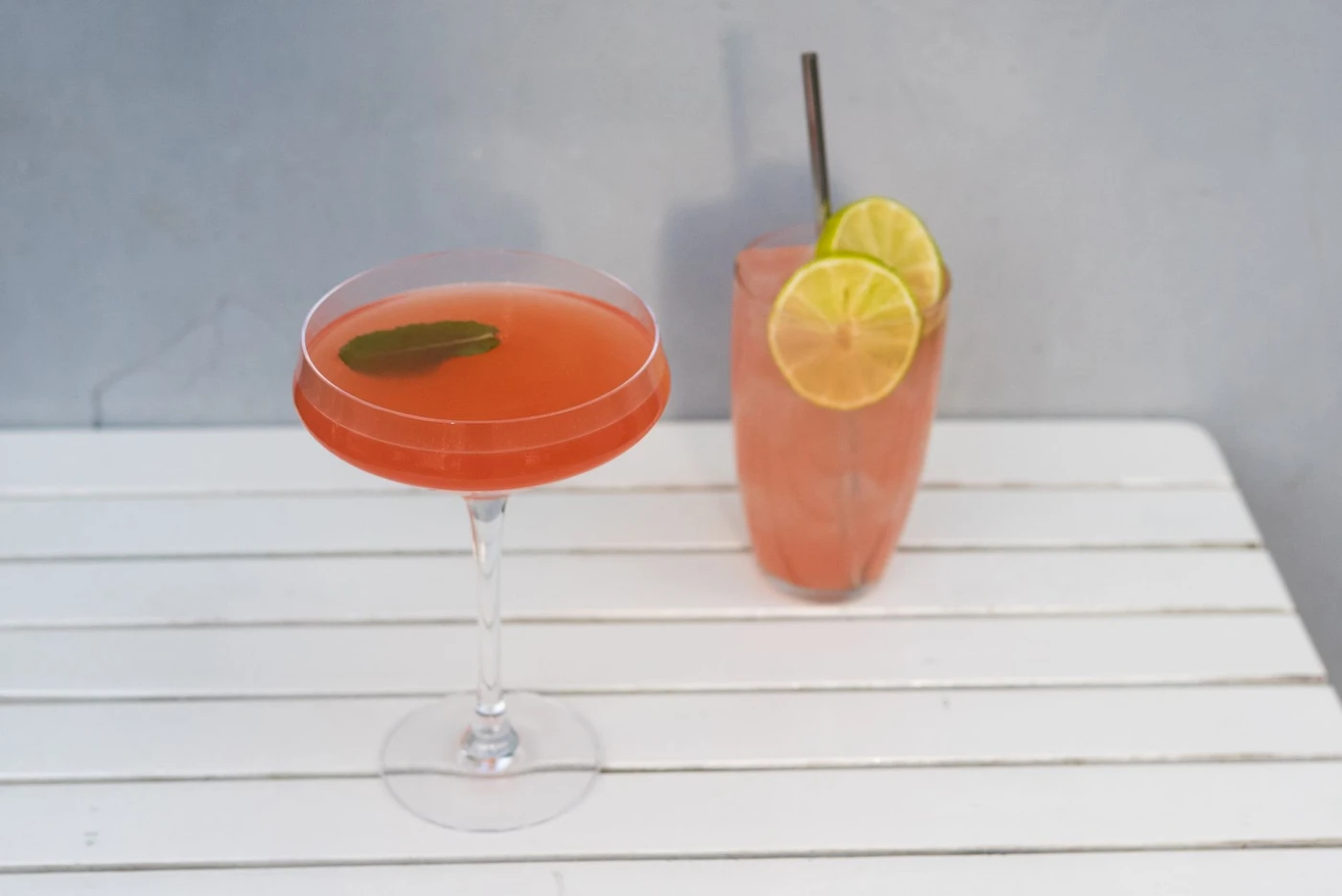 Kentucky Maid ingredients with cocktail bottle and bar tools
