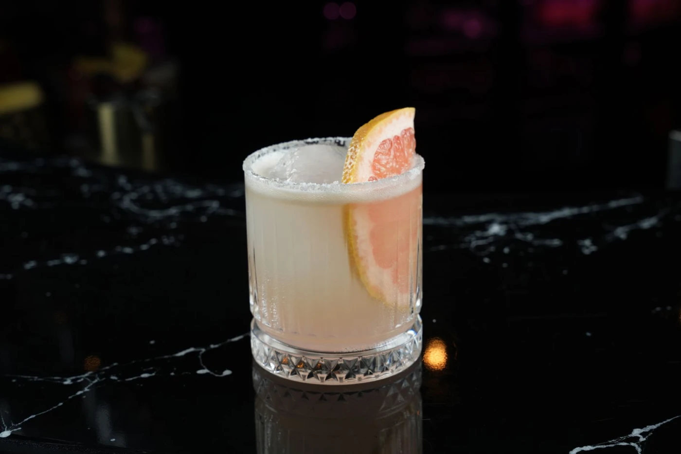 Mezcal Paloma cocktail in a highball