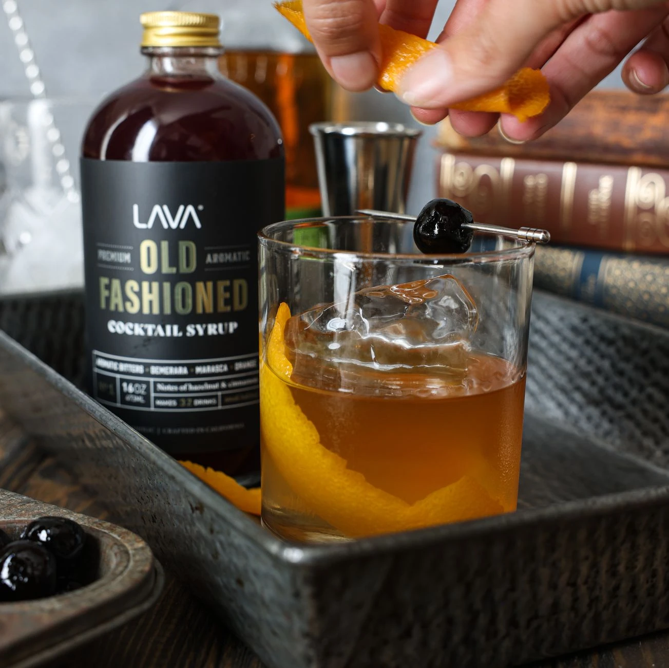 Oaxaca Old Fashioned with orange peel served over a large ice cube