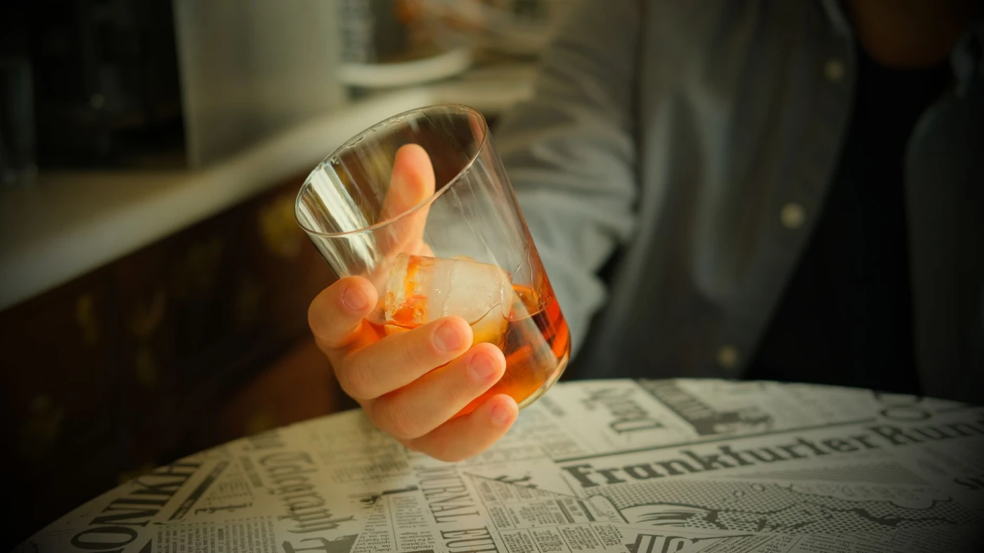 Oaxaca Old Fashioned served over a large cube in a rocks glass