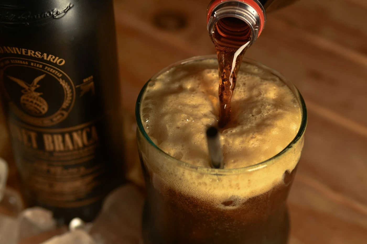 Ramos Fizz ingredients with cocktail bottle and bar tools