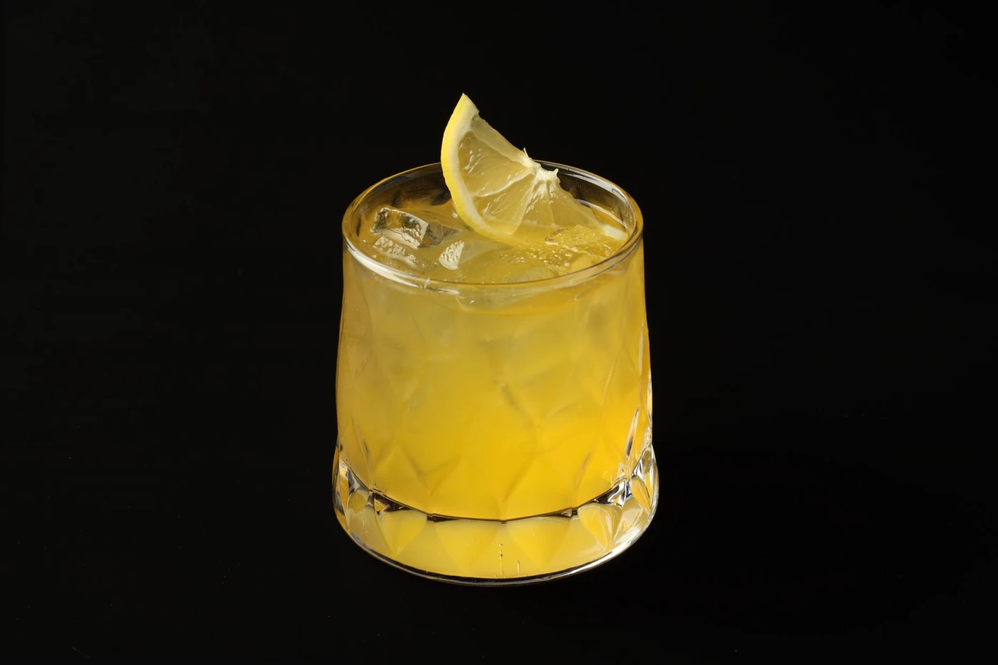 Resa Mueller’s Amaretto Sour ingredients with cocktail bottle and bar tools