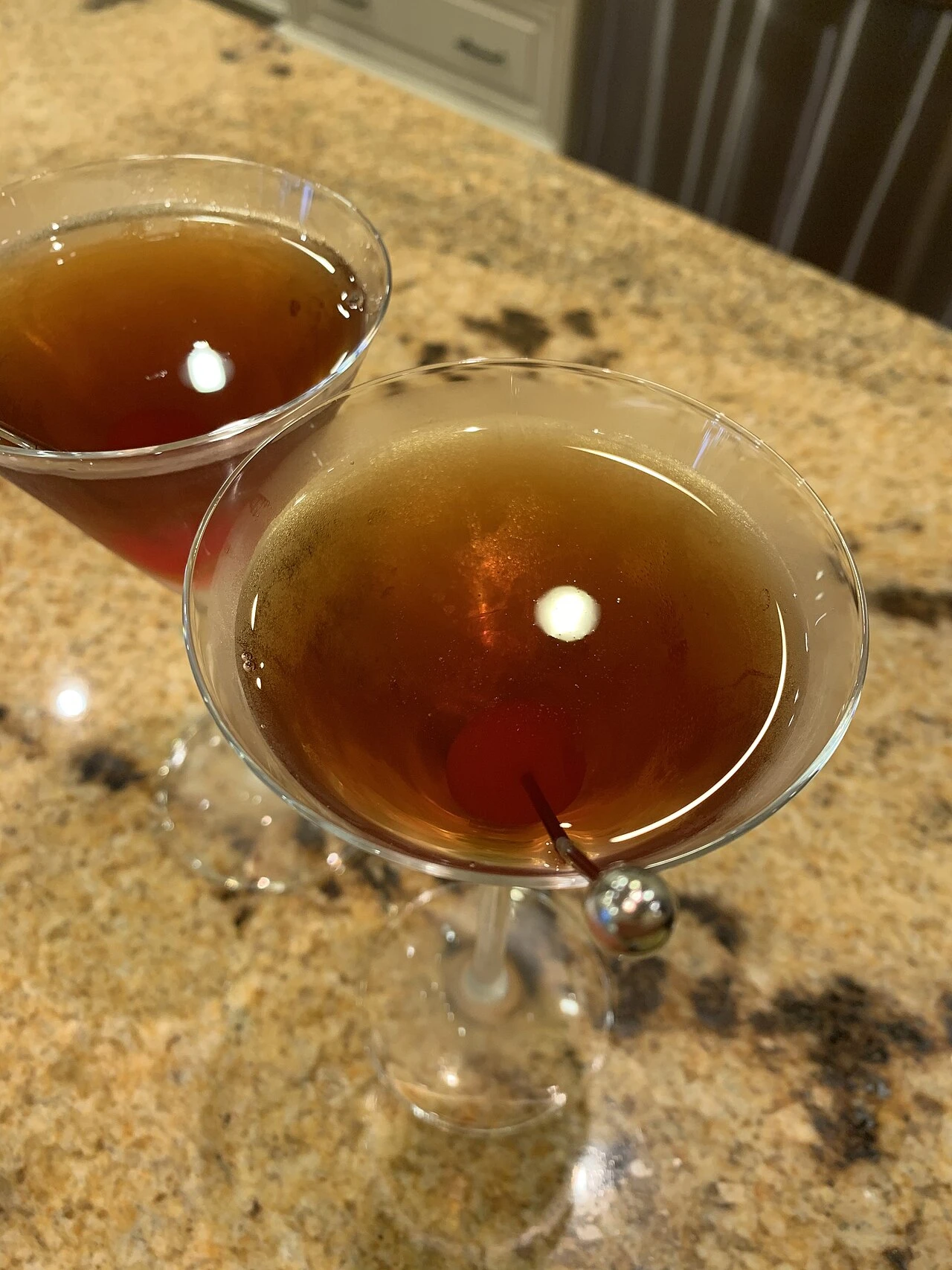 Two Manhattan cocktails viewed from above