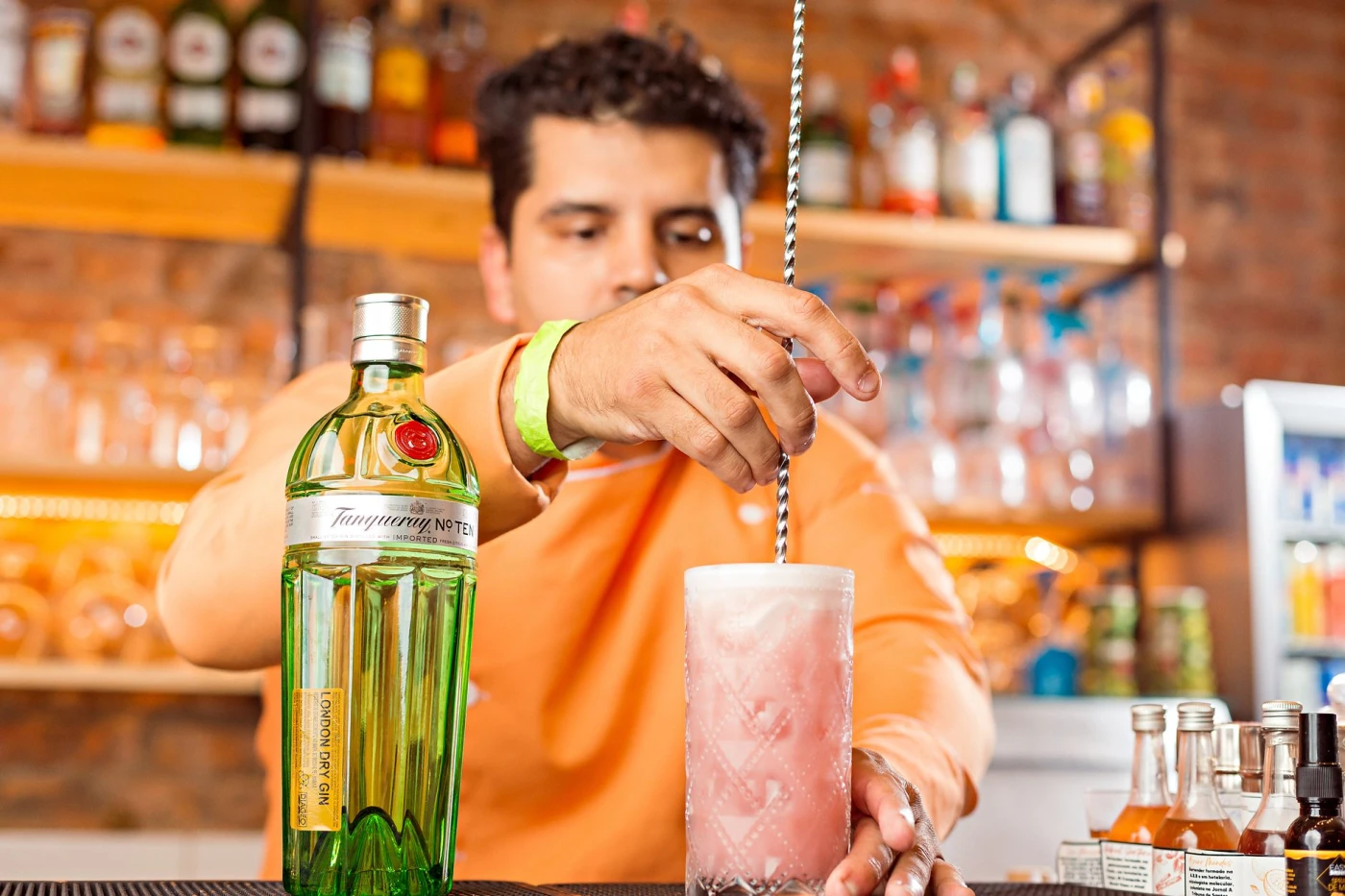 UK craft gin cocktail in a cocktail glass with bright botanical garnish