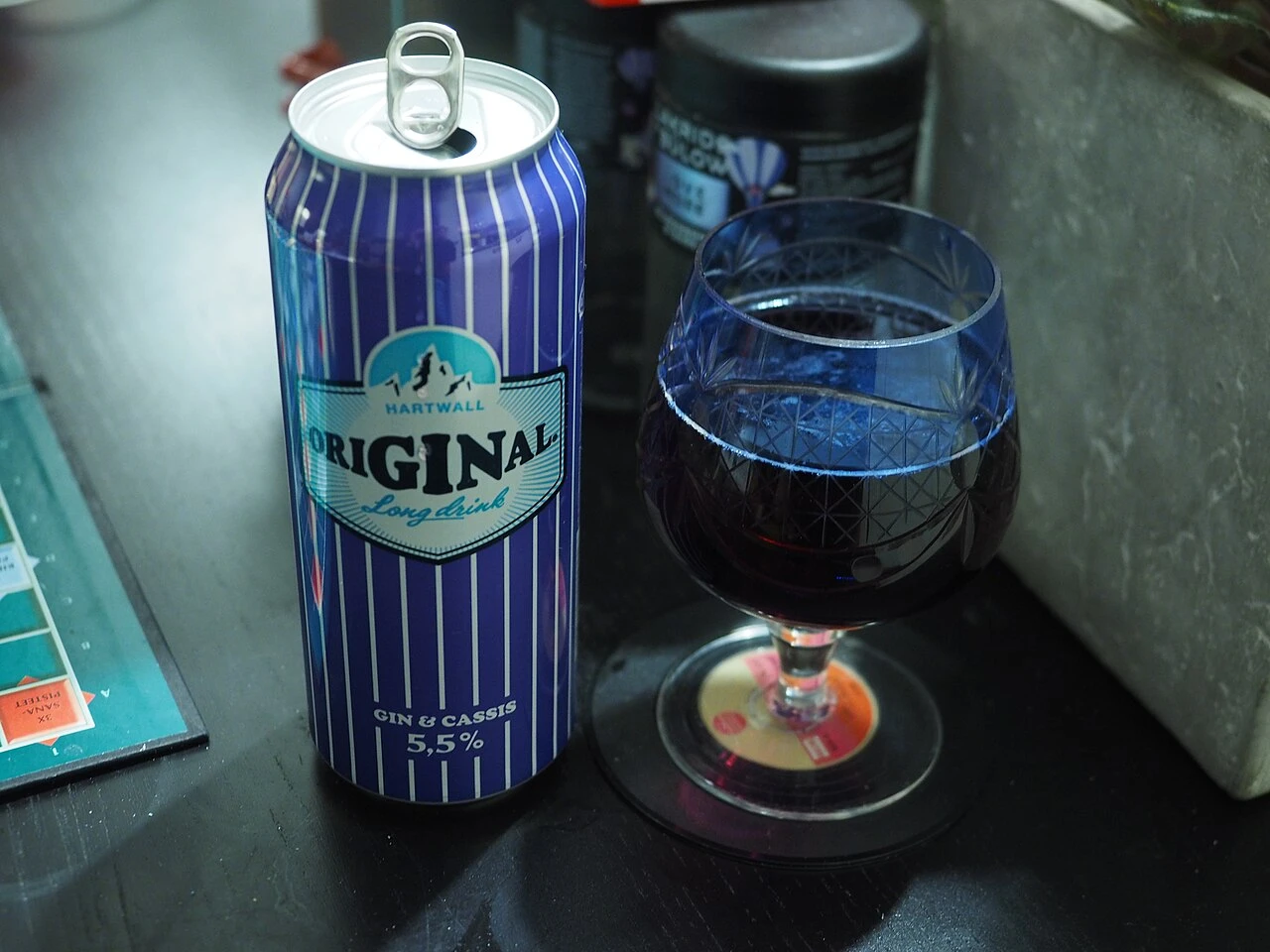 Gin and cassis long drink with fruit garnish