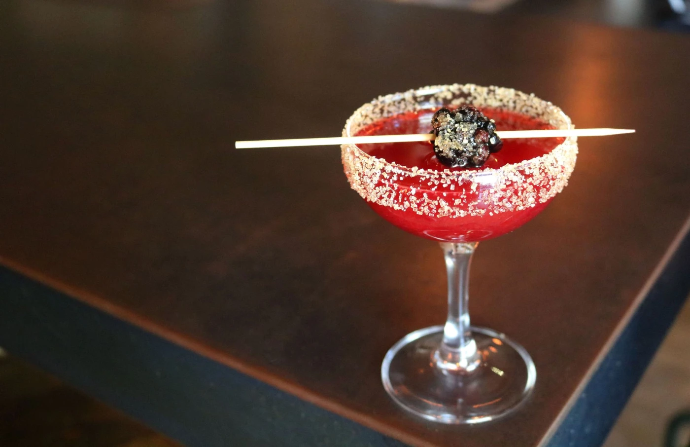 Lemon twist garnish above a clear Tuxedo No. 2 cocktail