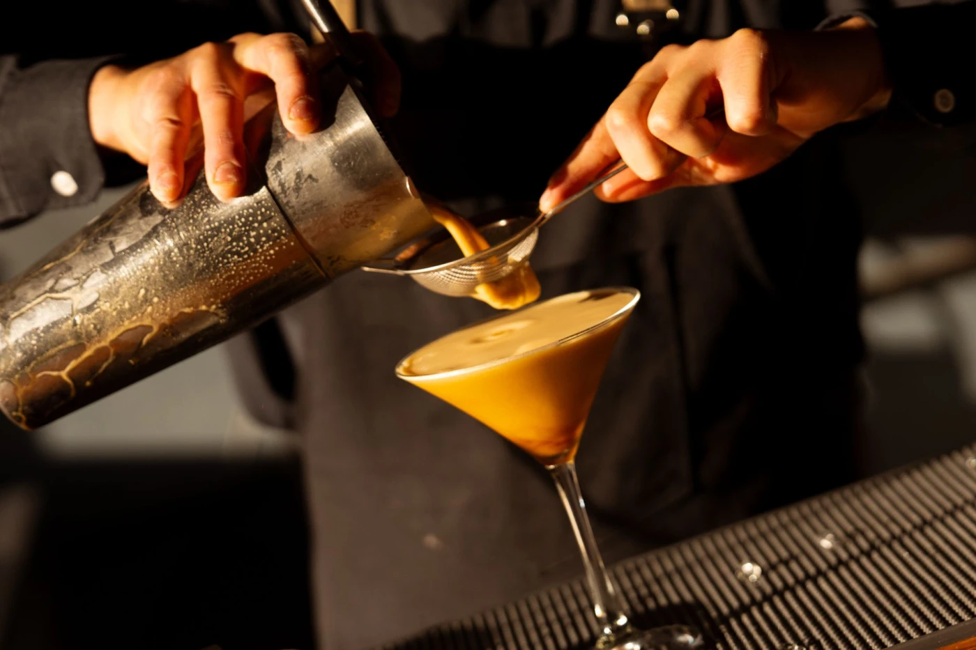Thunder Gun Espresso: Barista expertly pouring a rich espresso cocktail in a cafe setting, capturing the art of drink maki